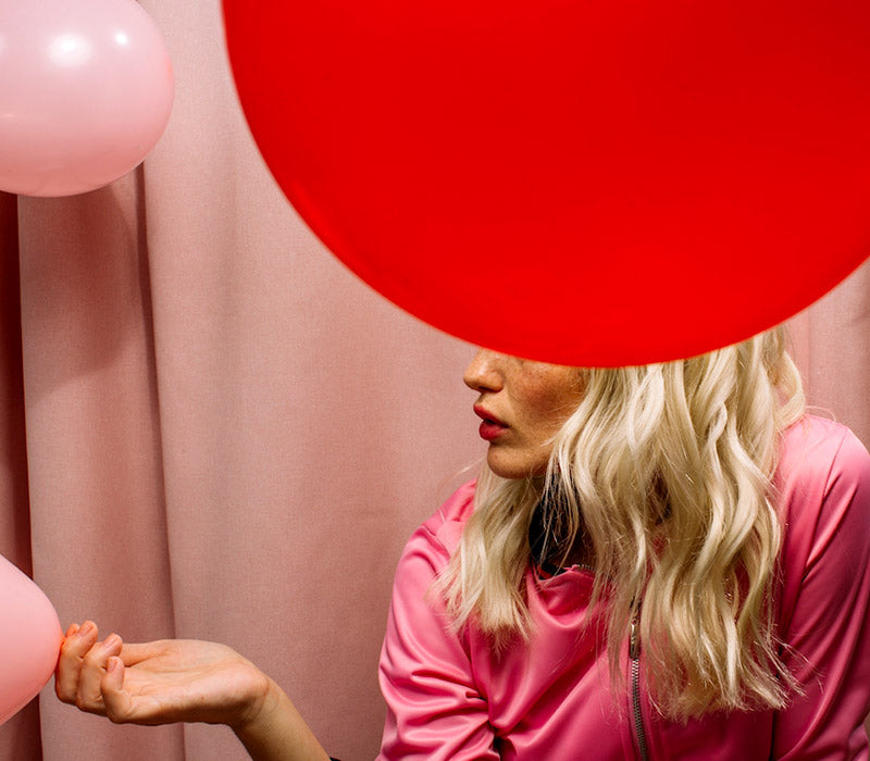 Scarlet Period Model with pink top and red circle for Period Cup Blog