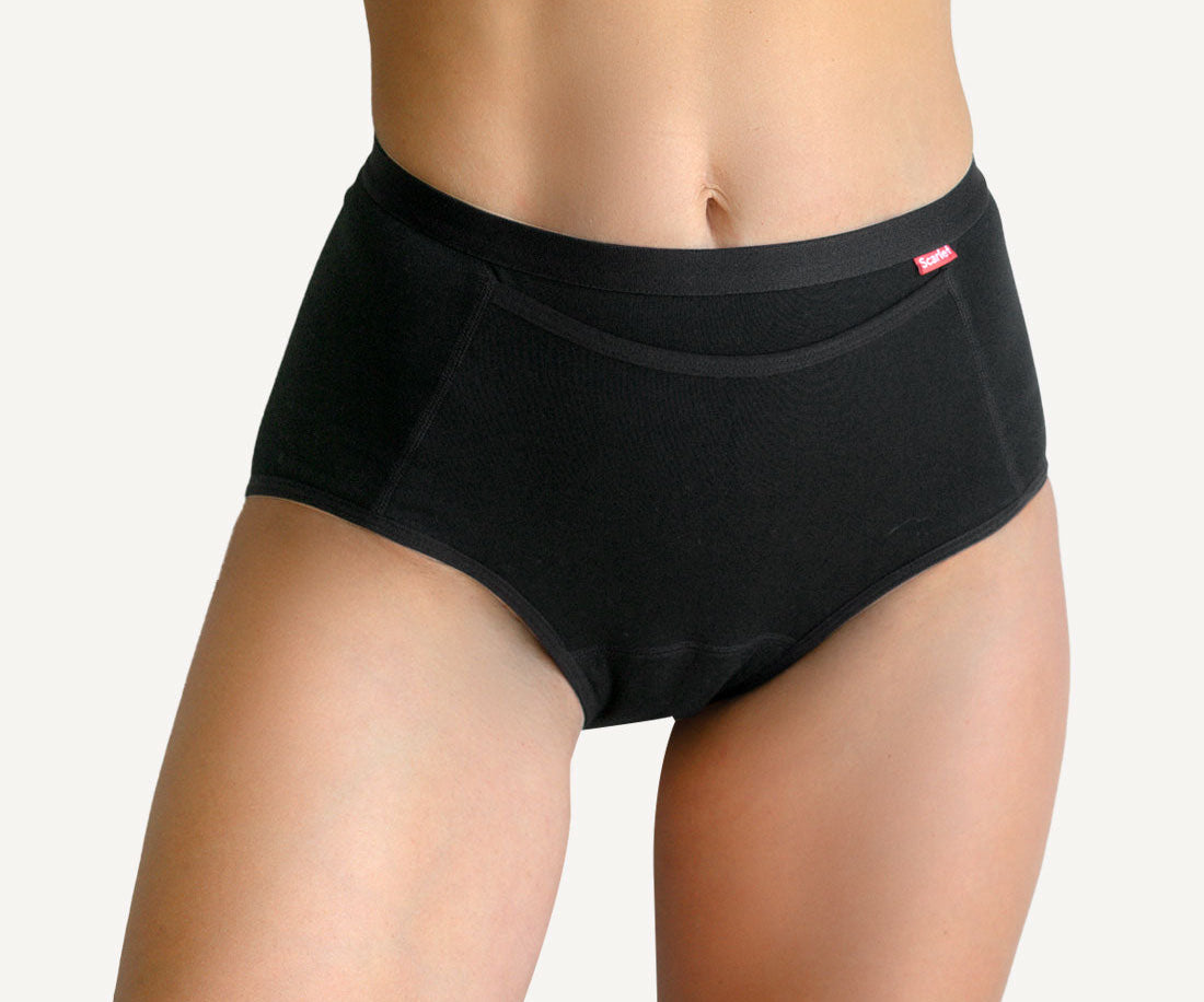 Scarlet Everyday Pocket Brief in black, worn high on the waist, with the front pocket that holds rae