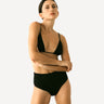Woman wearing Scarlet Period High-Waist Swim Brief against a white background