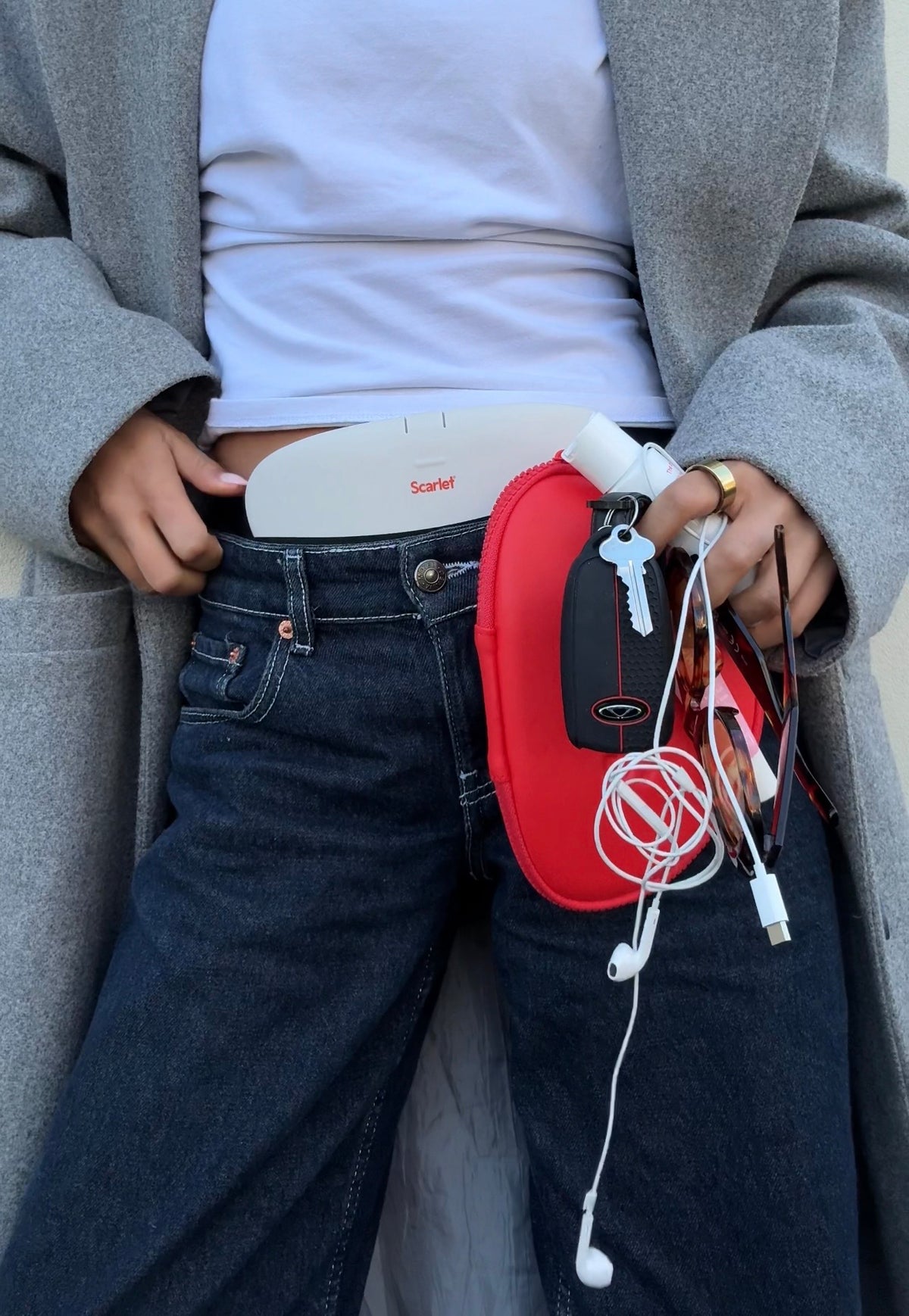 rae worn under jeans waistband out of the house, keys and charger in hand